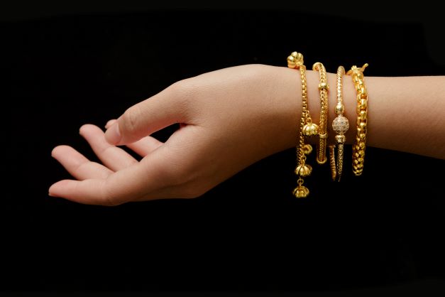 Women with 4 bracelets on her wrist