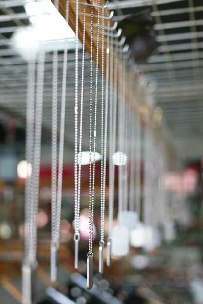Customised necklaces hanging up