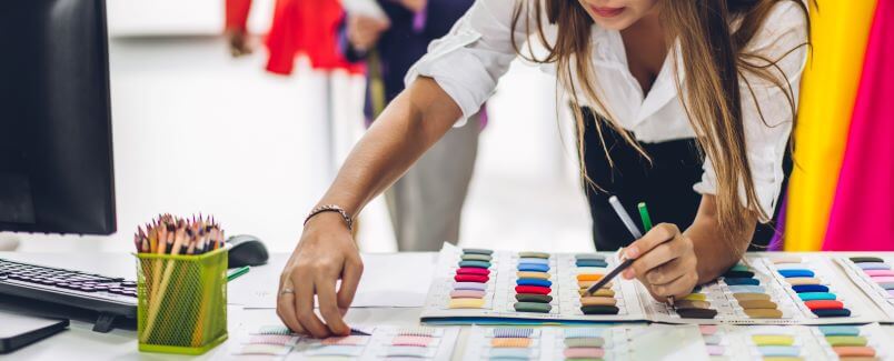 fashion designer works with fabric samples