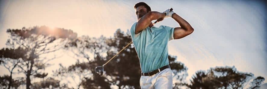 man hits ball in golf