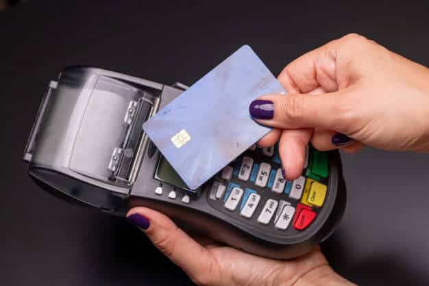 woman paying by contactless technology