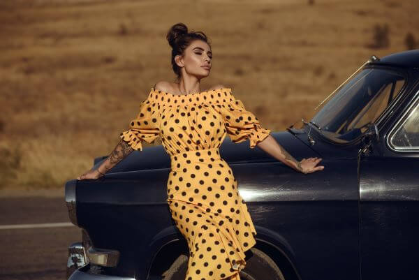 Dark haired lady wearing polka dot dress