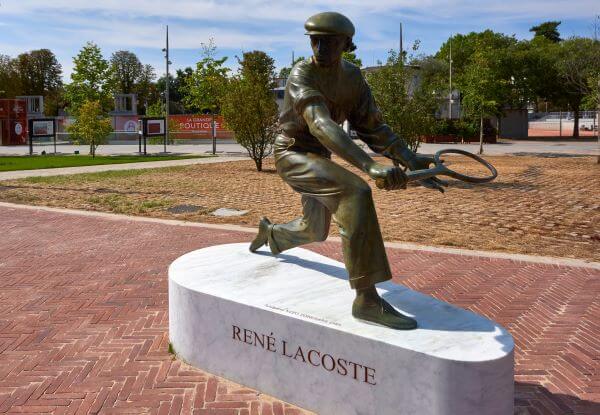 A statue of The man who became king of the tennis court and king of men's polo shirts