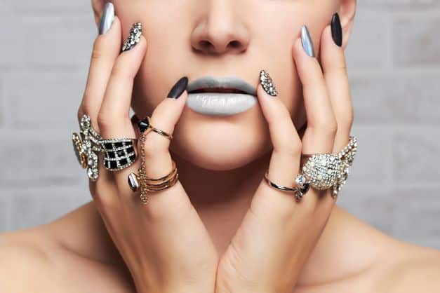 Woman wearing many rings on each finger