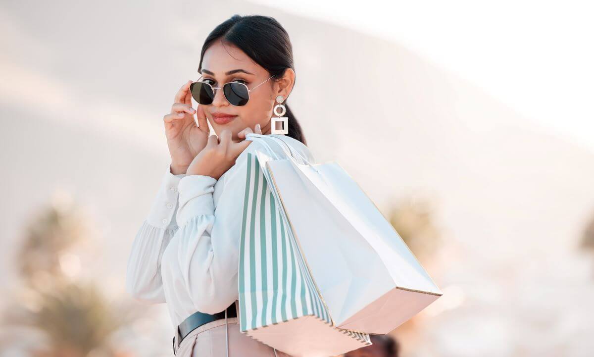 shopping with bags with luxury designer clothes