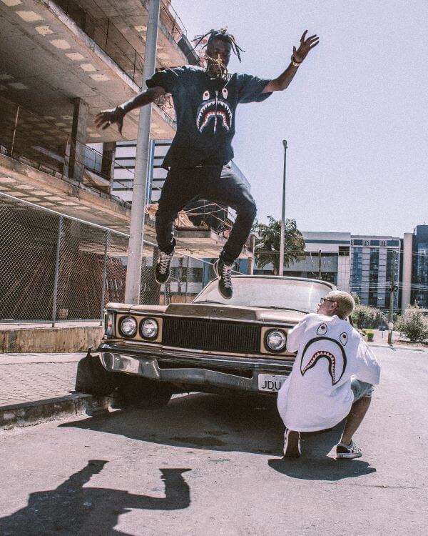 Two men hanging out by cool American car