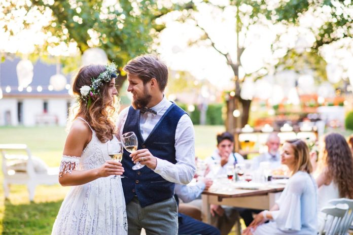a new bride in a stunning wedding reception dress